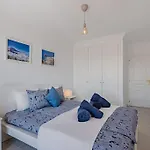 Seaside Apartment With Spacious Terrace, Pool, And Wi-Fi