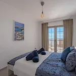 Seaside Apartment With Spacious Terrace, Pool, And Wi-Fi